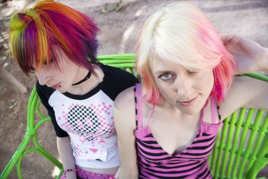 Two Pretty Punk Girls on a Green Bench