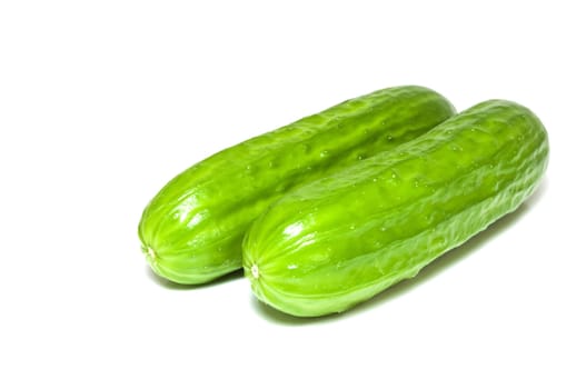 Fresh high resolution photo of two isolated cucumbers.