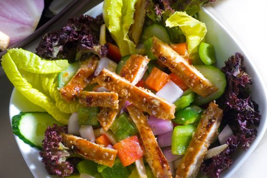 fresh colorfull sesame chicken salad close up