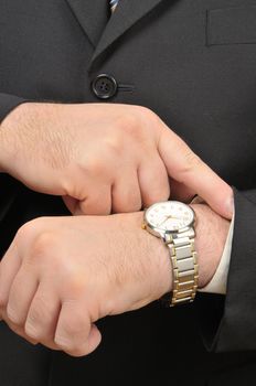 Business man looking at his wristwatch.