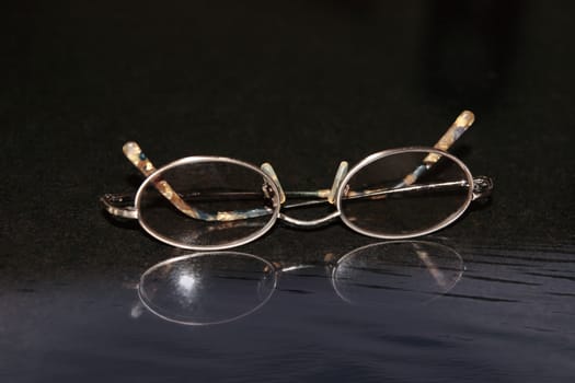 a pair of spectacles beside the waters edge