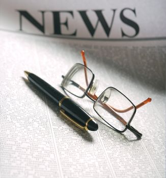 smart glasses on newspaper page. information media