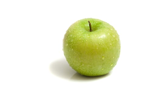 close up on a fresh, organic green apple, isolated on white, copy space