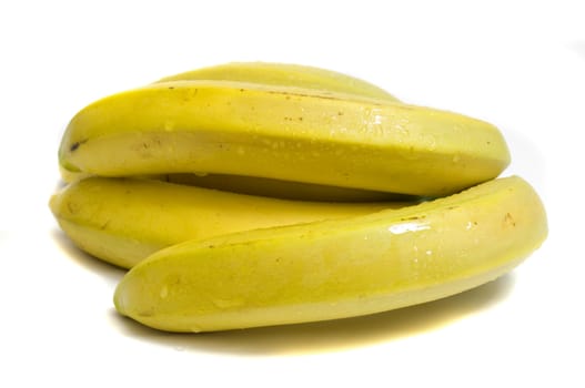 close-up on a bunch of fresh organic bananas, isolated on white, copy space