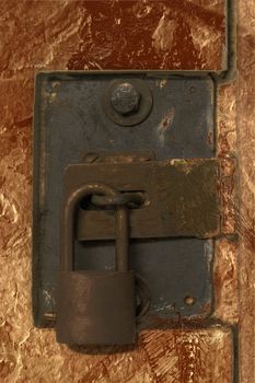 Pad Lock on Old Steel Metal Door