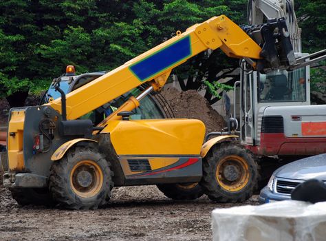 A photograph of a fork-lift truck active on an English building site