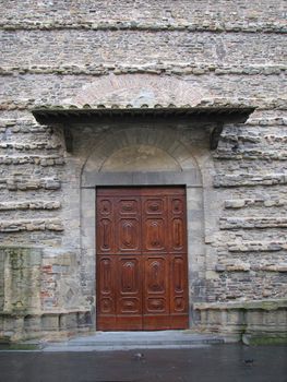 Wooden doors in old building in Italy