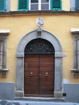 Wooden doors in old building in Italy