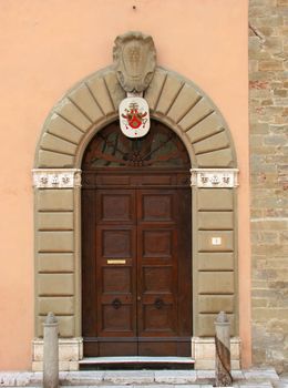 Wooden doors in old building in italy