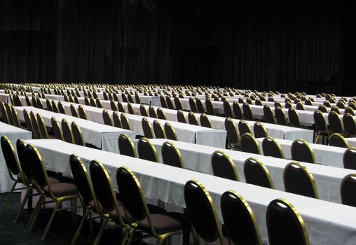 An auditorium set up for a cnference meeting. 
