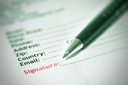 Signature in form of paper with pen.