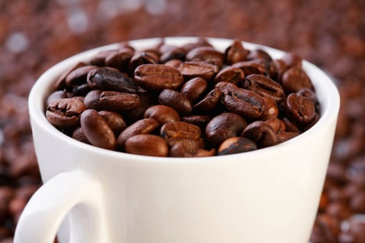 Coffee beans in a cup. Selective focus