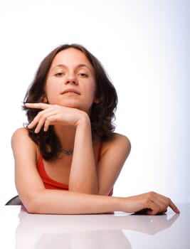 Beautiful young woman posing on white background