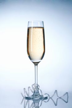 Glass of champagne with festive ribbons