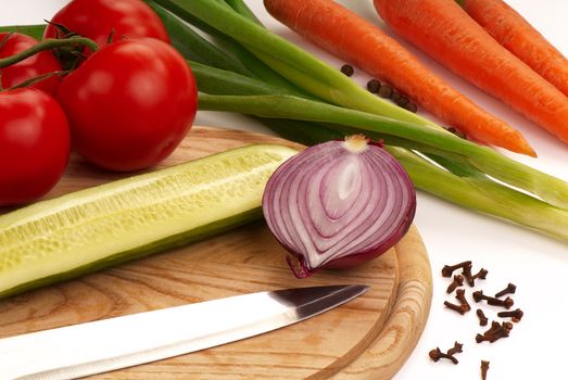 Still-life with onion, tomatoes, carrots and seasonings