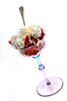 Ripe strawberry with creamin bowl on a white background