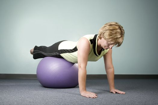 Woman doing Workout Balancing on an Exercise Ball
