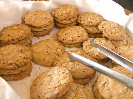 Basket full of Cookies at Brunch with Tongs