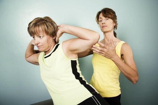 Personal Trainer Supervises a Woman Working Out