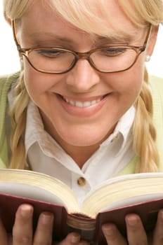 Female With Ponytails Reads Her Book isolated on a White Background.