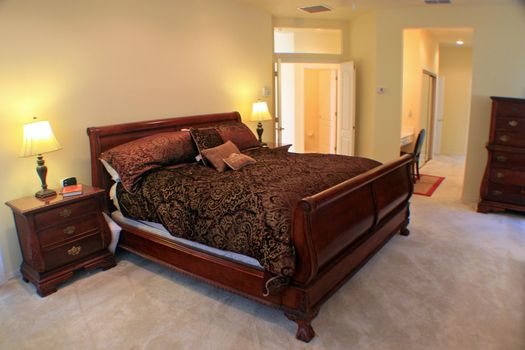 A Large Master Bedroom with sleigh bed.
