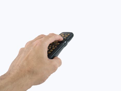 A male hand holds a remote control for an electronic media device. Over a white background.