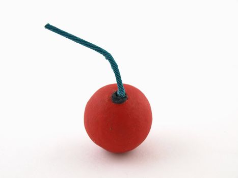 A Red Smoke bomb with a blue fuse isolated on a white background