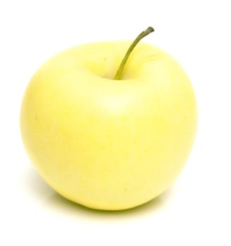 The ripe juicy yellow apple . Isolation on white, shallow DOF.
