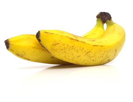 ripe bananas on white. Shallow DOF.