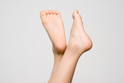 Children's feet on a light background