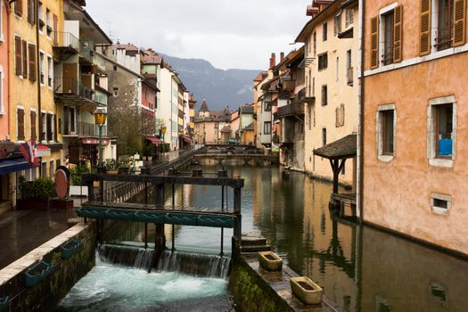 Canal with sluice gate at medieval town of Annecy, France