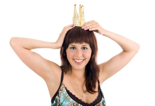 Young attractive princess holding a crown on her head