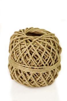 Roll of brown cord on white background