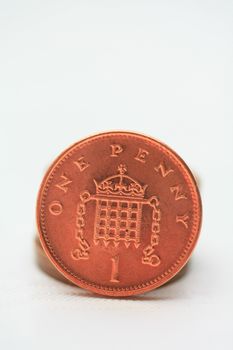 One penny, an English brass coin, isolated in close up