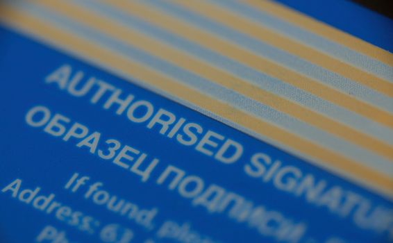 macro pattern of signature strip of credit card, contain word "authorised signature"
