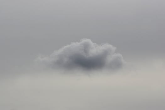 Single cloud on a moody sky