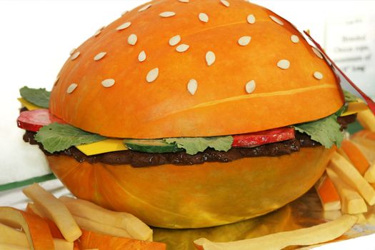 Art hamburger  made from all vegetables. Bun made from pumpkin.
