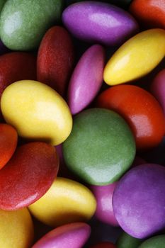 Close-up background of multi colored smarties candy