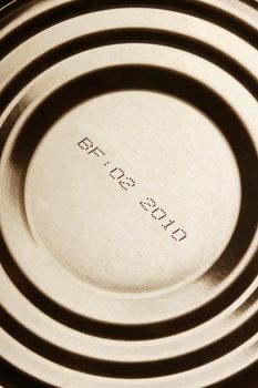 Close-up of canned food with expiration date