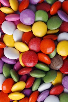 Close-up background of multi colored smarties candy