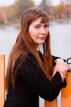 Portrait of  lady in black dress in the park
