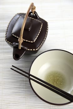 Asian bowl and chopsticks and tea pot