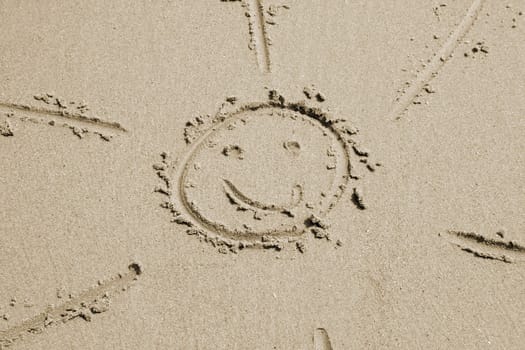 the sun drawn in the sand