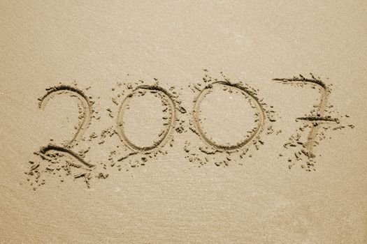 the number 2007 written in sand