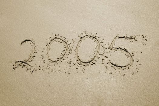 the number 2005 written in sand