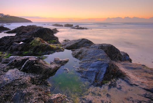 Beautiful sunset by the ocean on Newquay, Cornwall, UK