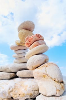 A pile of the stones are stacked on the coast