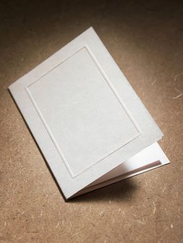 close up of the blank card on the brown table