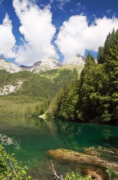 summer view of a beautiful lake in Italian alps. Photo taken with polarized filter