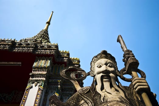 A stone statue at a temple in Bangkok, Thailand